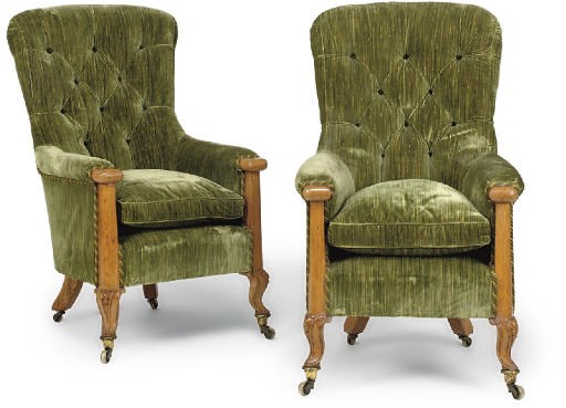 A PAIR OF MID-VICTORIAN OAK EASY ARMCHAIRS
