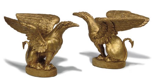 A PAIR OF GILTWOOD MODELS OF GRIFFINS