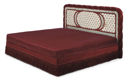 A RED VELVET AND SKY BLUE SILK DAMASK AND FLORAL COTTON UPHOLSTERED BED