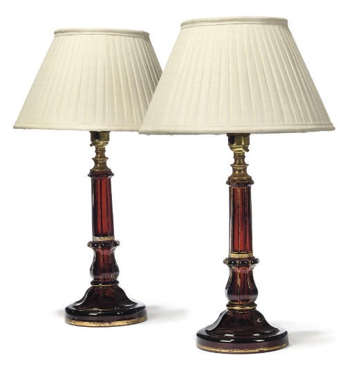 A PAIR OF GILT-HEIGHTENED RUBY GLASS CANDLESTICKS