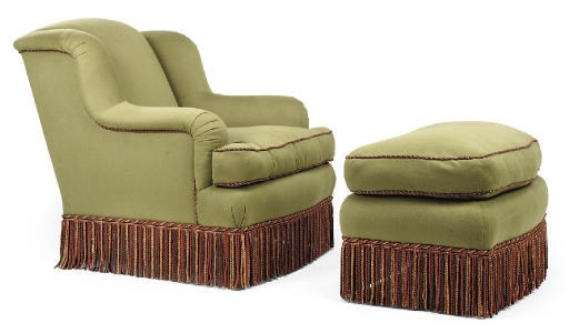 A GREEN UPHOLSTERED EASY ARMCHAIR AND MATCHING FOOT STOOL