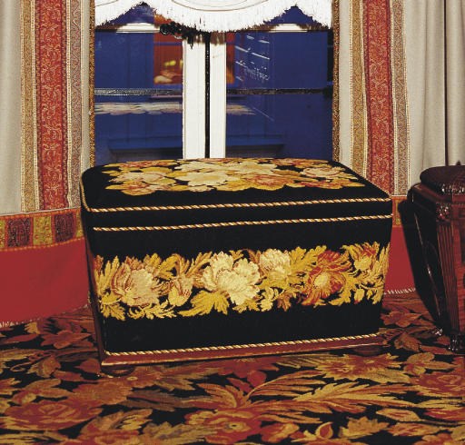 A GROS-POINT FLORAL NEEDLEWORK OTTOMAN