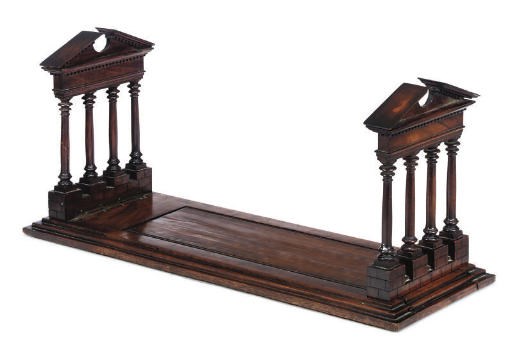 A GEORGE III WALNUT SLIDING BOOKSTAND