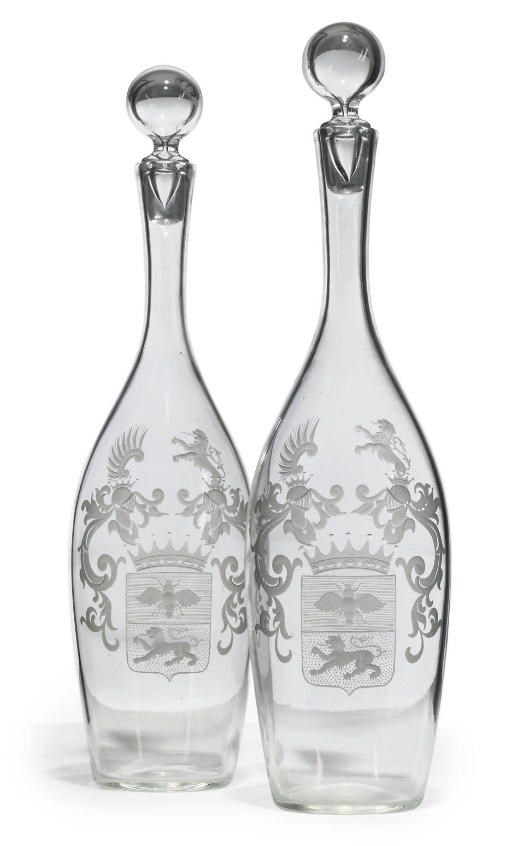 A PAIR OF CLEAR GLASS ARMORIAL MAGNUM DECANTERS AND STOPPERS
