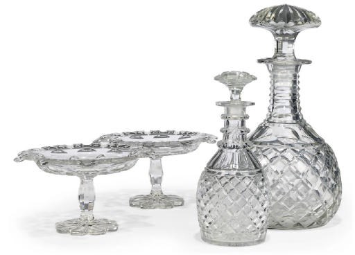 A CUT-GLASS MAGNUM DECANTER AND STOPPER, ANOTHER DECANTER AND STOPPER AND TWO COMPORTS