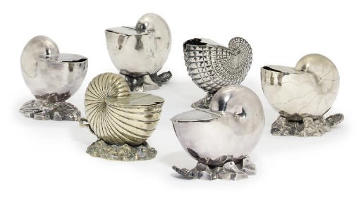 A GROUP OF SIX VARIOUS SILVER-PLATE AND METALWARE SPOON-WARMERS