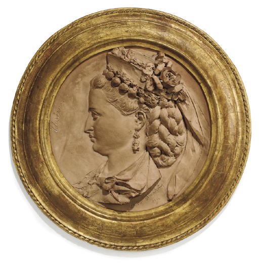 A TERRACOTTA ROUNDEL OF A LADY IN PROFILE