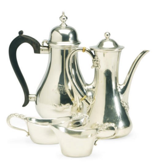 AN AMERICAN SILVER THREE-PIECE COFFEE SERVICE AND AN COFFEE POT**,