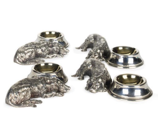 A SET OF FOUR AMERICAN SILVER-PLATED SALTS MODELED AS RETRIEVERS WITH BOWLS,