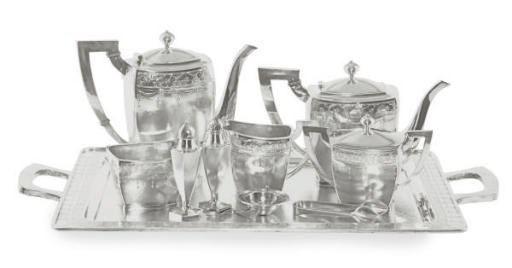 A JAPANESE SILVER FIVE PIECE TEA AND COFFEE SERVICE AND FIVE OVAL SERVIING DISHES,