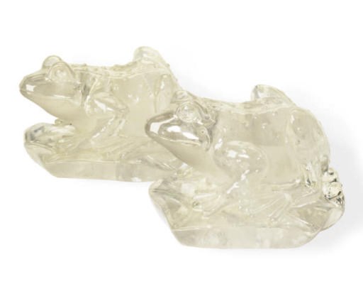A PAIR OF ROCK CRYSTAL MODELS OF FROGS ON LILY PADS,