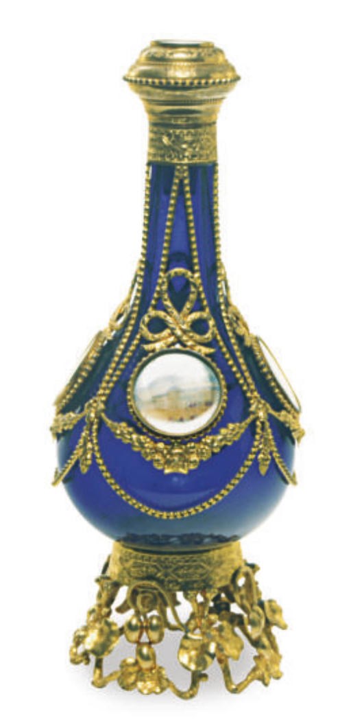 A CONTINENTAL GILT METAL-MOUNTED BLUE GLASS BOTTLE VASE AND HINGED STOPPER APPLIED WITH LANDSCAPE MINIATURES ON IVORY,**