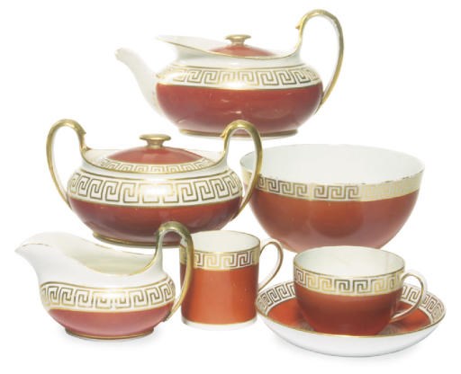 AN ENGLISH PORCELAIN QUEENSWARE IRON RED GROUND PART TEA AND COFFEE SERVICE,