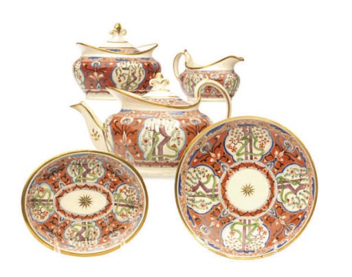 AN ENGLISH IRON-RED GROUND 'MONEY TREE' PATTER PART TEA AND COFFEE SERVICE