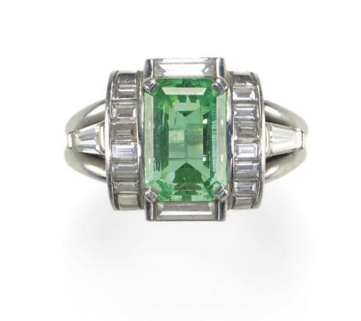 AN EMERALD, DIAMOND AND PLATINUM RING