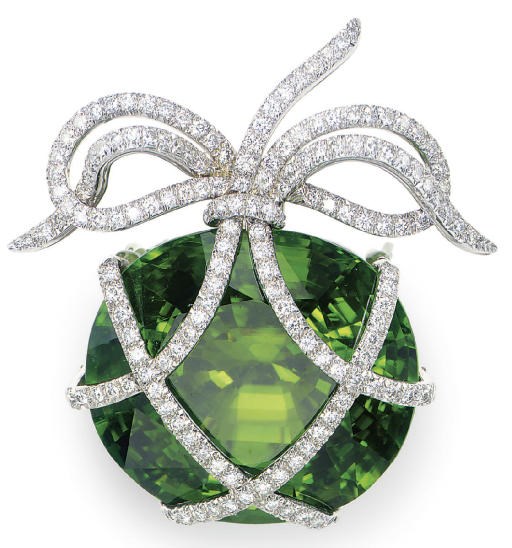 A PERIDOT, DIAMOND AND PLATINUM BROOCH, BY VERDURA