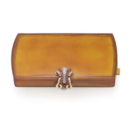 A DIAMOND, SIMULATED RUBY, GOLD AND PLASTIC VANITY