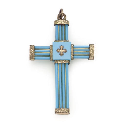 AN ANTIQUE GLASS CROSS PENDANT
