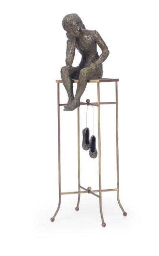 A PATINATED BRONZE FIGURE,