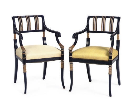 A SET OF FOUR EBONIZED AND PARCEL-GILT OPEN ARMCHAIRS,