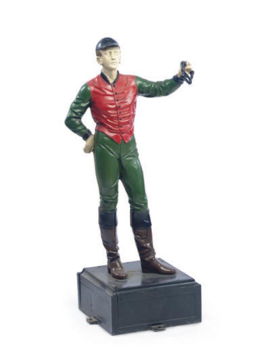 A POLYCHROME-PAINTED CAST IRON LAWN JOCKEY,