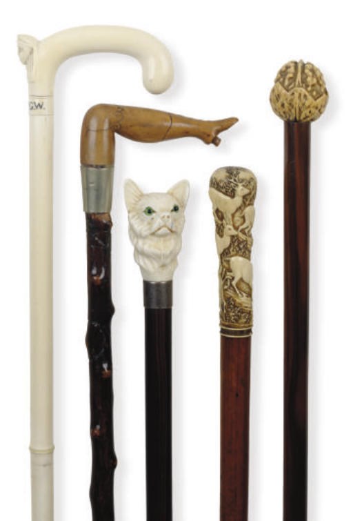 A GROUP OF EIGHT WALKING CANES**,