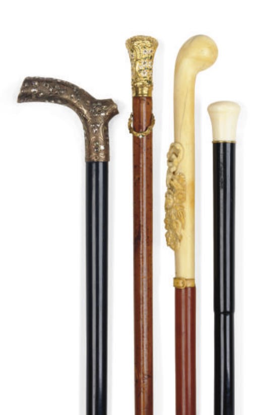 A GROUP OF FOUR WALKING STICKS**,