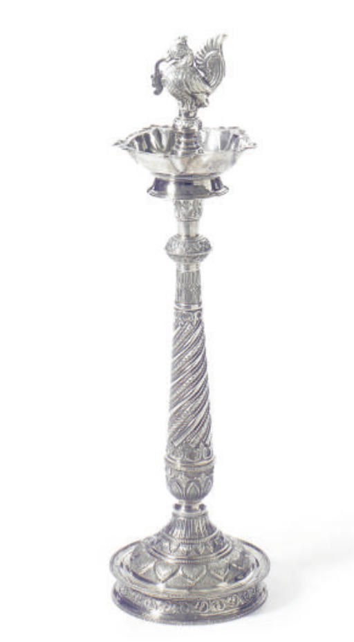 A PAIR OF SILVERED METAL REPOUSSE SMOKING STANDS,