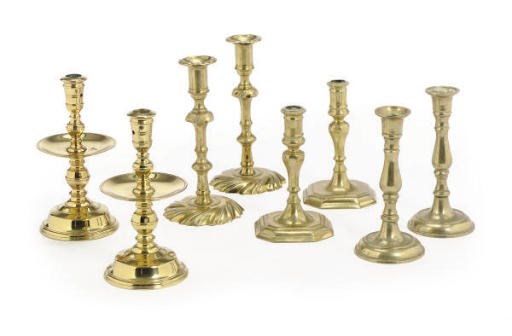 A GROUP OF FOUR PAIRS OF BRASS CANDLESTICKS,