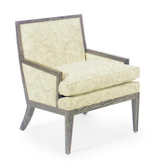 A LIMED WOOD UPHOLSTERED ARMCHAIR,