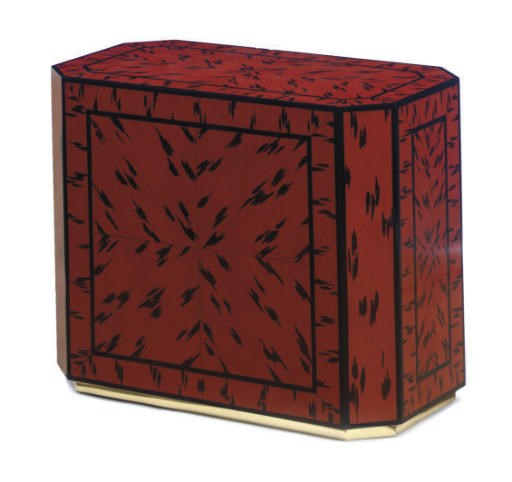 A RED AND BLACK LACQUERED PEDESTAL TABLE