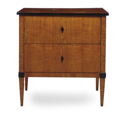 A BIEDERMEIER BIRCH AND PART-EBONIZED COMMODE,