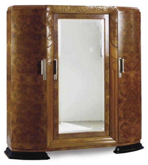 AN ART DECO CARVED WALNUT ARMOIRE,