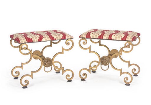 A PAIR OF PATINATED AND GILT-METAL CUSHIONED STOOLS,