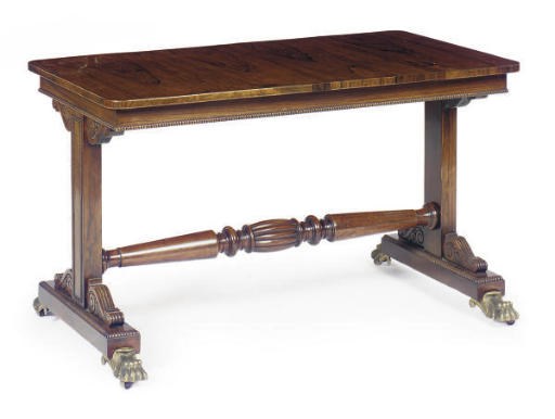 A REGENCY ROSEWOOD AND MAHOGANY LIBRARY TABLE**,