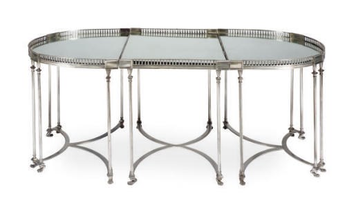 A SILVERED METAL AND MIRRORED SURTOUT DE TABLE,