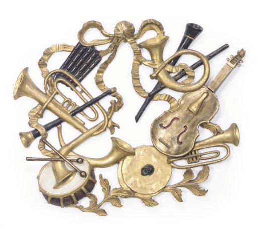A GILT AND BLACK-PAINTED MUSICAL TROPHY,