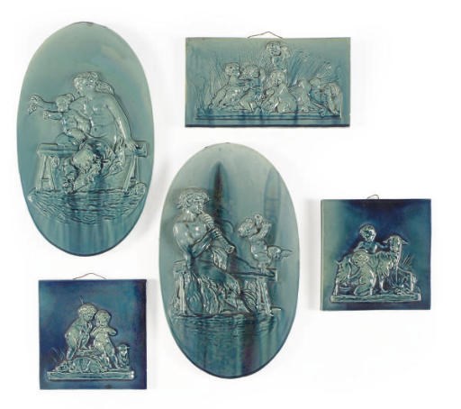 A PAIR OF GLAZED EARTHENWARE ALLEGORICAL RELIEF PLAQUES,