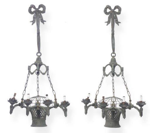 A PAIR OF PATINATED BRONZE BASKET FORM FOUR-BRANCH WALL-LIGHTS,