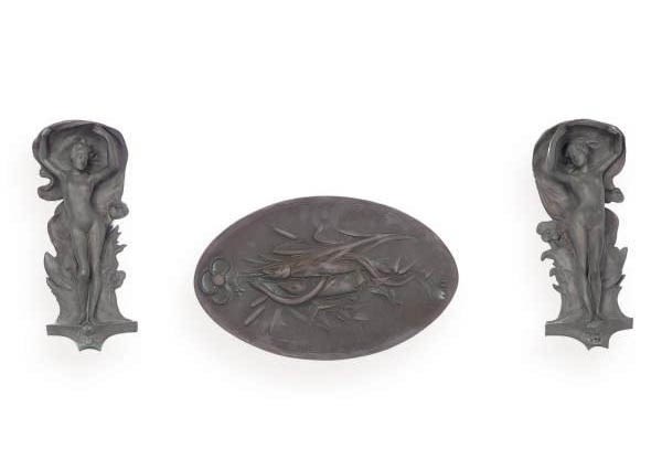 A PAIR OF PATINATED BRONZE RELIEF MOLDED FIGURAL WALL PLAQUES,