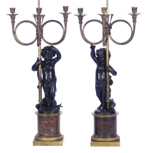 A PAIR OF FRENCH PATINATED AND GILT-BRONZE THREE-LIGHT CANDELABRA,