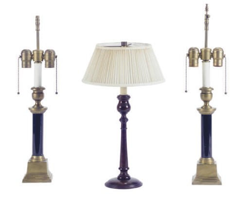 A PAIR OF BRASS AND BLACK MARBLE CANDLESTICKS LAMPS,