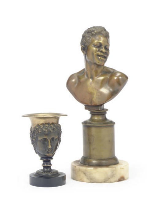 A PATINATED BRONZE BUST OF A MAN,