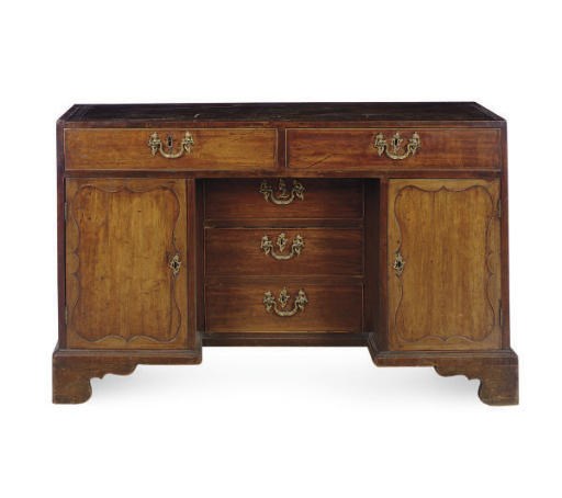 AN ENGLISH MAHOGANY KNEEHOLE DESK,