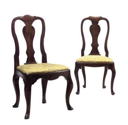 A MATCHED SET OF SIX CONTINENTAL WALNUT DINING CHAIRS,