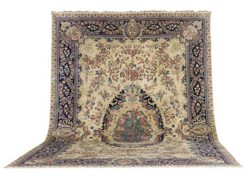 A KIRMAN CARPET,