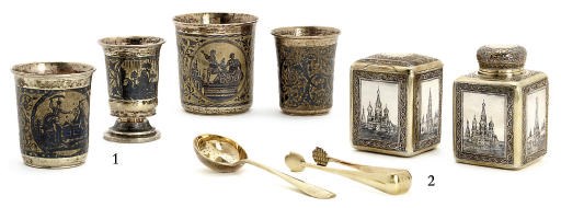A set of parcel-gilt and niello caddies with a pair of sugar-tongs and a strainer