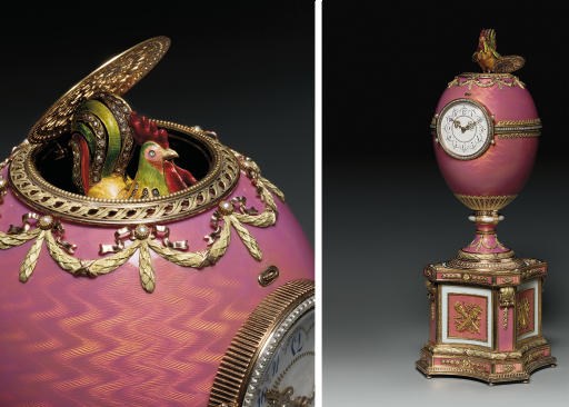 A JEWELLED VARI-COLOURED GOLD-MOUNTED AND ENAMELLED EGG ON PLINTH, INCORPORATING A CLOCK AND AN AUTOMATON