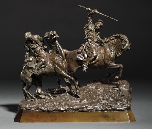 A bronze group of two horsemen