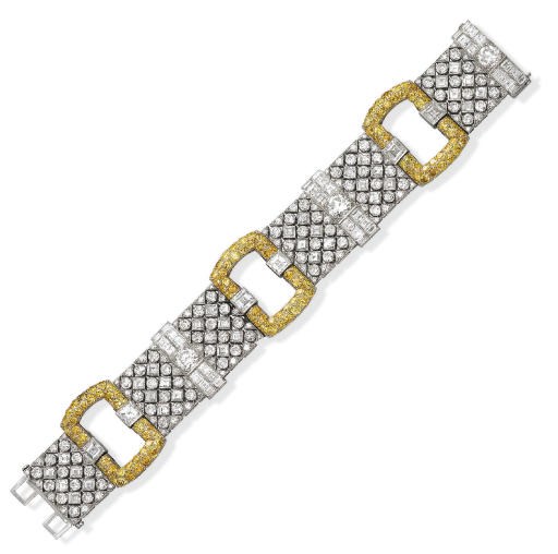 AN ART DECO DIAMOND AND COLOURED DIAMOND BRACELET